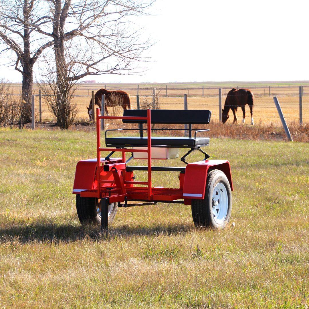ACS Forcart in a field with horses behind