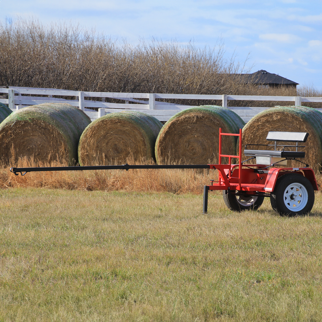 ACS Forcart in a field with Tongue installed  with hay bales in the background
